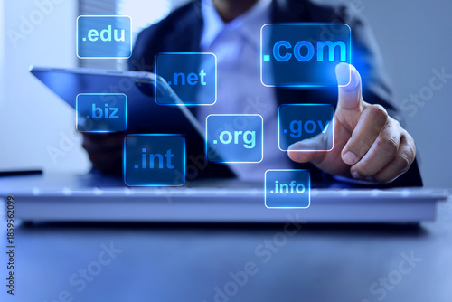Domain name concept with businessman touch on .com to be a top level of website domain in business webpage globally recognized dot com to default choice