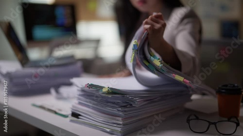 Overwhelmed office worker frantically searching for a document in a large pile of paperwork. Stressed employee dealing with bureaucracy
