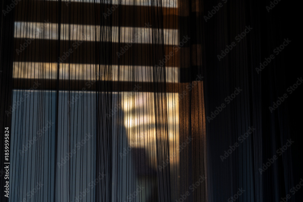 Φωτογραφία Sheer curtain filtering soft light from a window, creating a warm, inviting ambiance