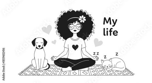 Young woman with an afro hairstyle and glasses meditating in lotus pose on a patterned rug with her sleeping dog and cat at her side.