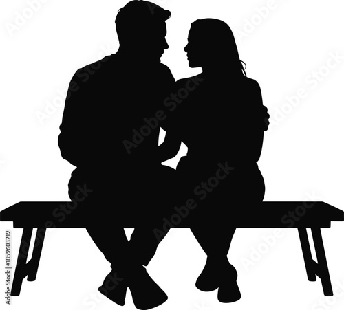 Silhouette of a couple sitting closely together on a park bench