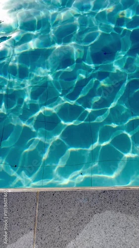 Crystal Clear Turquoise Water in Swimming Pool with Shimmering Light