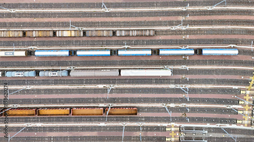 Aerial View of Halle Freight Railway Yard with Multiple Tracks and Cargo Trains