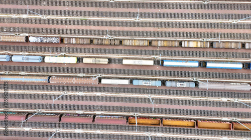 Aerial View of Halle Freight Railway Yard with Multiple Tracks and Cargo Trains