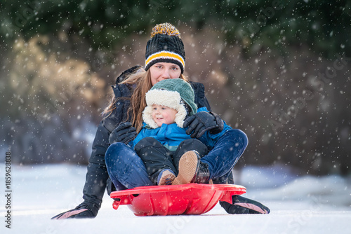 Mom Takes Son on Sled Ride
