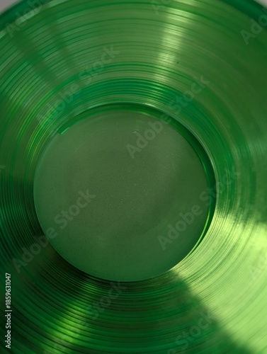 Photography Abstract green glass composition with circular lines and reflections, artistic minimal background concept