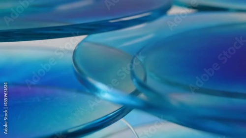 Wallpaper Mural Colorful Transparent Blue Glass Disks on a Soft Background with Artistic Light Reflections Torontodigital.ca