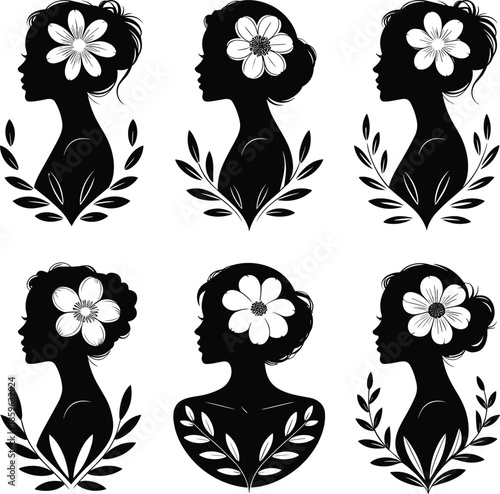 Elegant black silhouettes of women s profiles adorned with delicate flowers and leaves