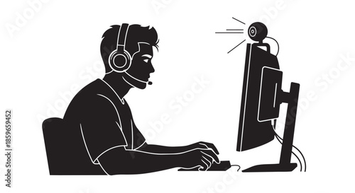 Young man in headset with microphone using computer for gaming or live streaming