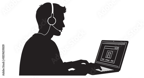 A silhouette of a person wearing a headset with a microphone while working on a laptop