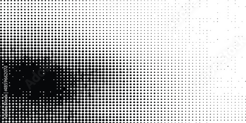 Black halftone dots create a minimalist gradient texture on a white background. Abstract black and white halftone dot pattern gradient with a textured look.