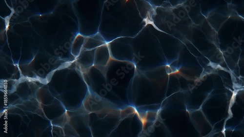 Moving caustic light patterns on dark water