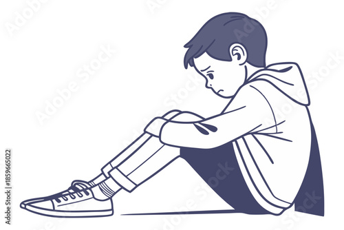 Unhappy toddler boy sitting on floor feeling upset isolated on white background