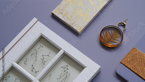 Artistic Still Life Composition Featuring a Constellation Window Frame, Decorative Box, Fern Pendant, and Woven Coaster on a Light Purple Surface