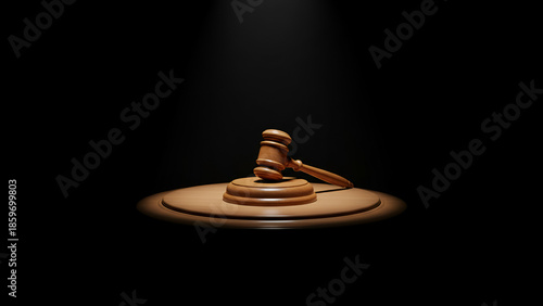 Judicial gavel on illuminated desk — courtroom justice concept with spotlight

