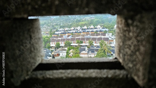 Aeral view of suburban houses with lush greenery in Indonesia.