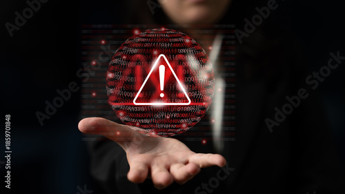 Foto A professional individual presents a warning symbol above the hand, embodying vigilance over data security threats in the digital age of technology and information