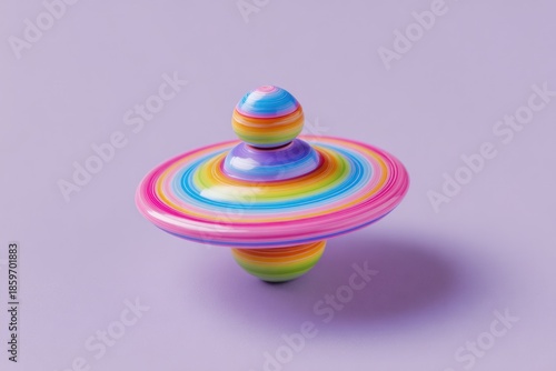 Colorful Spinning Top Toy on Purple Background.