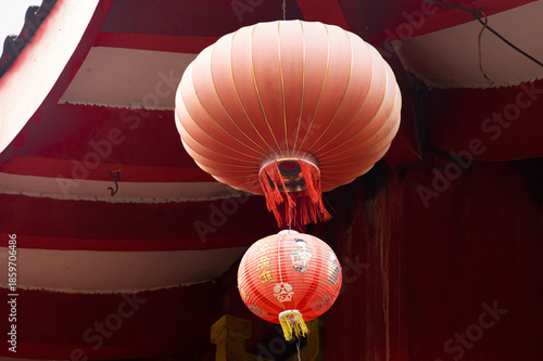 Red Chinese Lantern Hanging Under Temple Roof