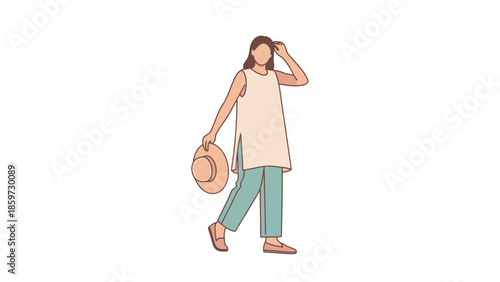 Stylish woman in casual summer outfit holding a hat and walking confidently in a minimalistic