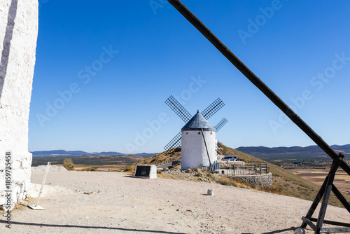 White centuries old windmill standing on hill in Consuegra, Spain
