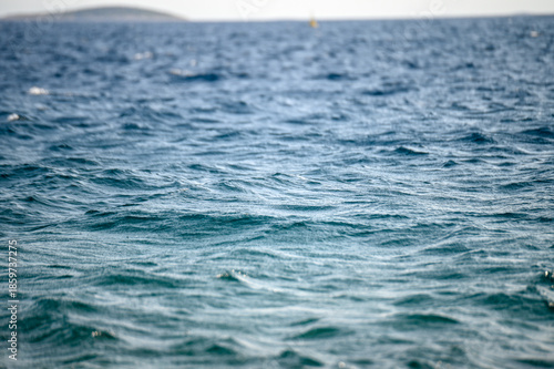 Detailed close up of rippling water. Blue sea surface at summer. 