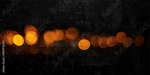 Glowing red hot chili peppers and burning candles reflect bright bokeh lights against a dark black background for a festive holiday celebration