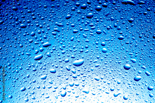 Foto Glass surface with water drops, closeup view