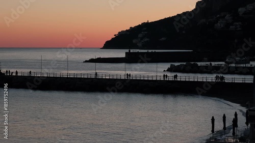 Sunset silhouettes of walkers on Amalfi