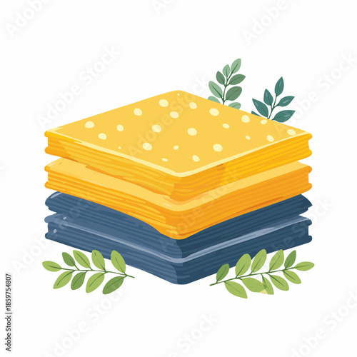 Stack of colorful cloths with leaves surrounding it on a white background