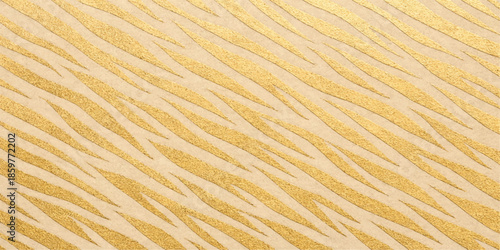 A golden desert dune features a dry sandy texture with a ripple pattern and sunlit orange waves of grain creating a natural brown summer background design