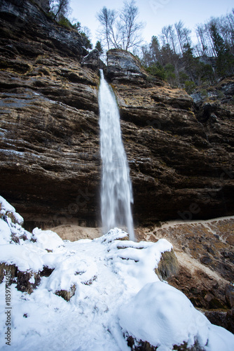 Pericnik waterfall in Vrata valley in Slovenia, winter landscape