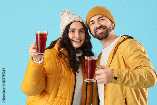 Happy young couple in warm ...