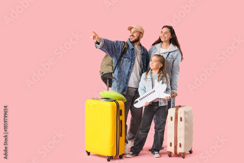 Family of travelers with pa...