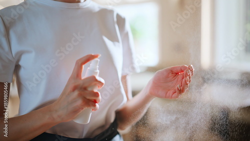 Photos Restaurant staff sanitizing hands at light modern restaurant workplace closeup