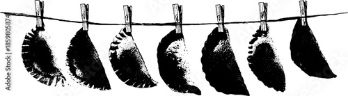 Black and white stencil art of hanging dumplings with clothespins