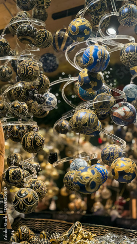 A close-up of a display case with Christmas tree decorations at a Christmas market in Vienna, Austria.