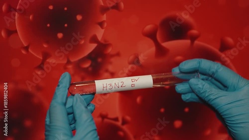 Gloved Hand Holding H3N2 Blood Sample for Virus Testing
