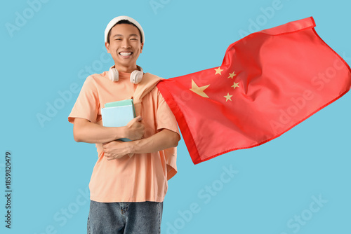Young Asian man with flag o...