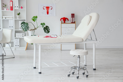 Interior of gynecologist's office with couch and plants