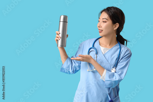 Female Asian doctor with th...