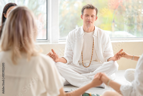 Group of people meditating ...