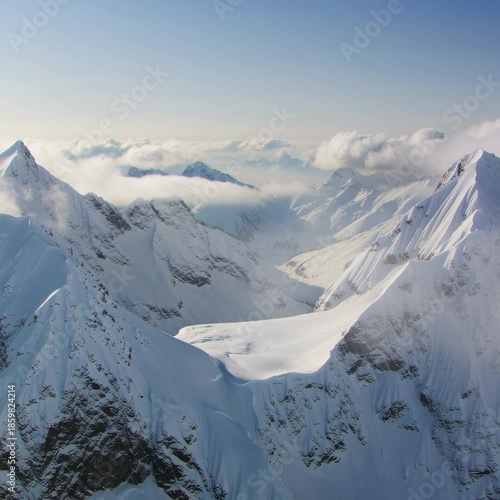 Breathtaking view of the snowy Rocky Mountains and valley on sunny day