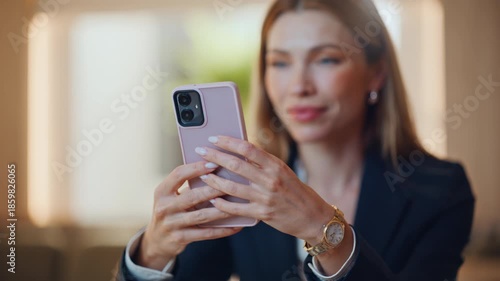 Happy businesswoman browsing smartphone app sitting restaurant at lunch closeup.