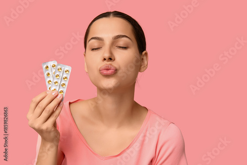 Pretty young woman holding ...