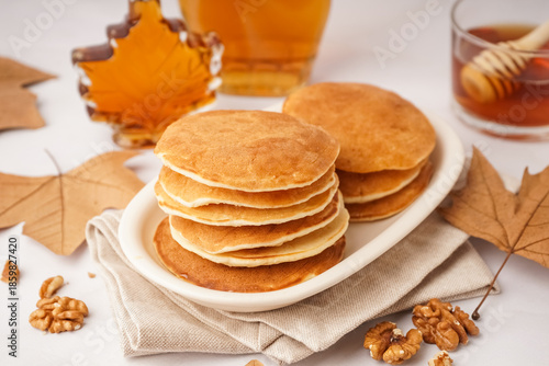 Plate of tasty pancakes wit...