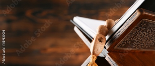 Koran and beads on blurred ...