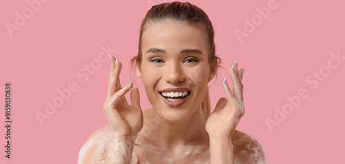 Happy young woman with foam...