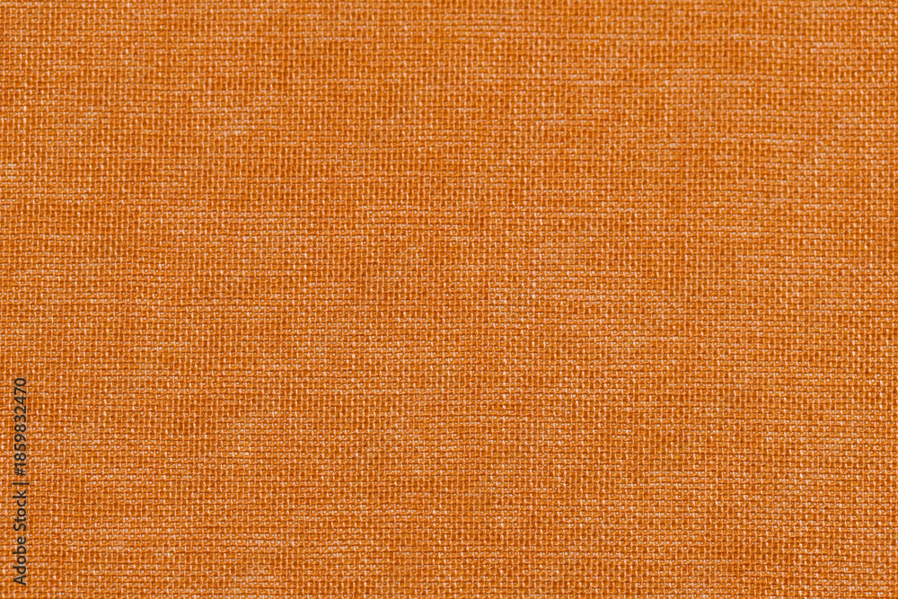 Fototapeta premium Abstract orange linen fabric background with visible natural fibers and subtle texture. Suitable for design overlays, social media graphics, and editorial use.