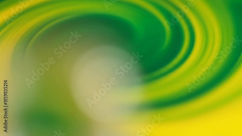 Dynamic abstract background featuring a vibrant green and yellow color swirl creating a mesmerizing and energetic visual effect with a smooth gradient transition and radial motion blur perfect for mo.